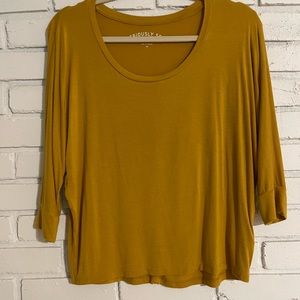 Extremely soft gold long sleeve shirt. Great condition.